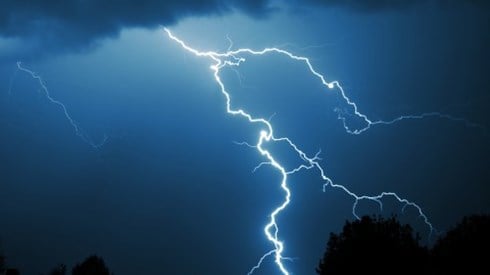Lightning strike in dark sky