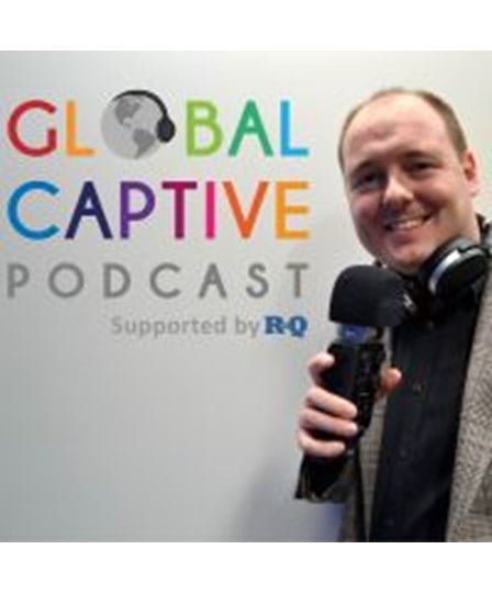 Global Captive Podcast supported by RQ and Podcaster Richard Cutcher with headphones and microphone 
