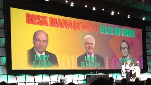 On stage photo of Risk Management Hall of Fame recipients including Gary Bird, James Hinton, and Reginald Pitchford