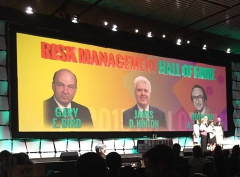 On stage photo of Risk Management Hall of Fame recipients including Gary Bird, James Hinton, and Reginald Pitchford