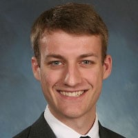 Aaron Koch wearing gray suit