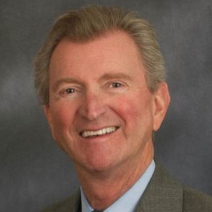 South Carolina Captives Director Jay Branum Smiling with Blue Shirt Collar