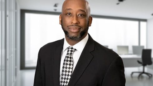 Profile of Roosevelt Mosley in an office.