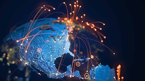 A globe with orange arcs of light emanating from points on globe