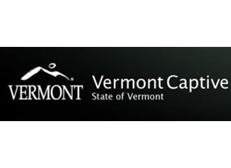 Vermont Captive mountain outline logo inside black box with contrasting white text
