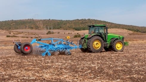 Agricultural machine in tilled field