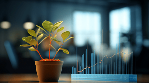 A Potted Green Plant Rests Atop an Office Desk with Upward Trending Line Graph Superimposed on Muted Background of Furniture and Windows
