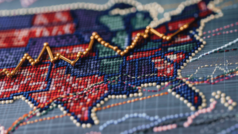 Cross-stitch map of United States with gold pinheads forming an upward-trending line graph