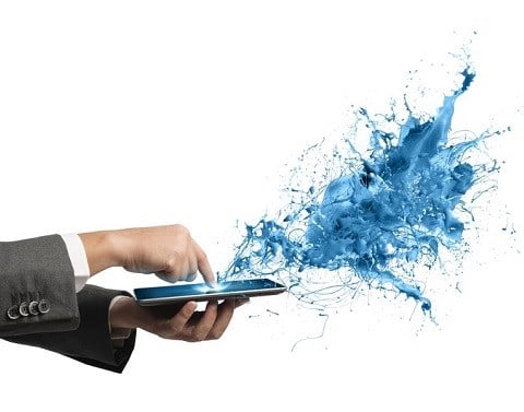A business professional´s index finger touches a smartphone display and releases a blue splash mix of water and electricity.