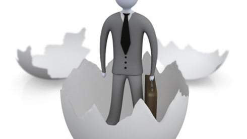 A 3D bubble businessman figure is standing in the base of hatched egg with the two upper sides of the egg in background