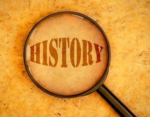 The word HISTORY shown through magnifying glass
