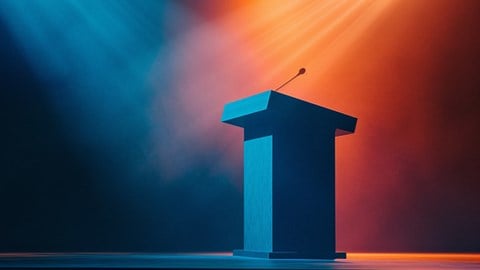 Orange and blue lights shining on a podium with a microphone
