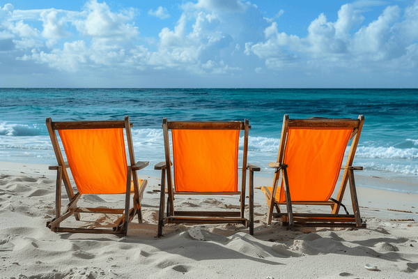 Three orange canvas beach chairs sitting on a beach next to each other