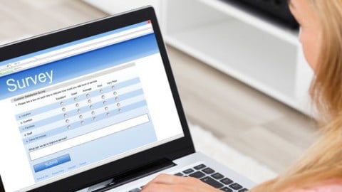 A woman taking an online survey on a laptop