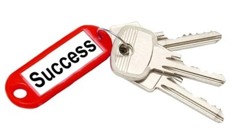 Three keys with a red keychain tag that says Success