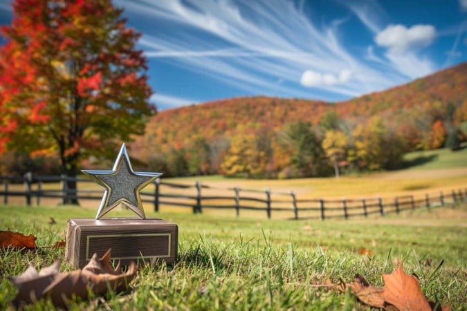 View of the Vermont countryside in the autumn season with a star trophy on the ground.
