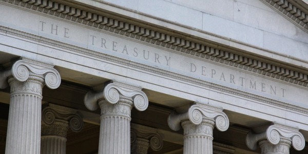 Closeup of the U.S. Treasury Department Building where the columns support the part of the roof with the name of the building.