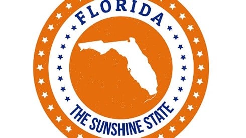 Orange Florida State Seal with white and blue text