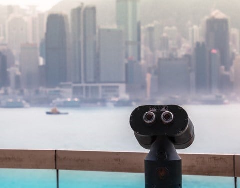 Coin operated binoculars with waterfront view of Hong Kong City