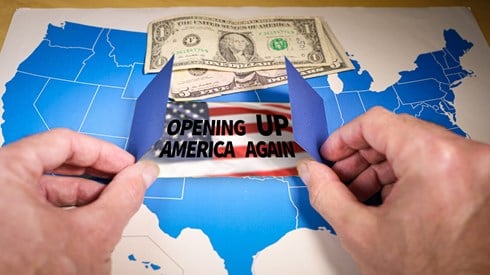 Depiction of a US map being opened by two hands revealing an American flag and the words OPENING UP AMERICA AGAIN beneat dollar bills