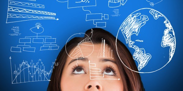 Woman looking up with charts and drawings on blue background and superimposed on her face
