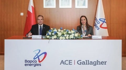 Bapco Energies and ACE Gallagher representatives sitting at a table