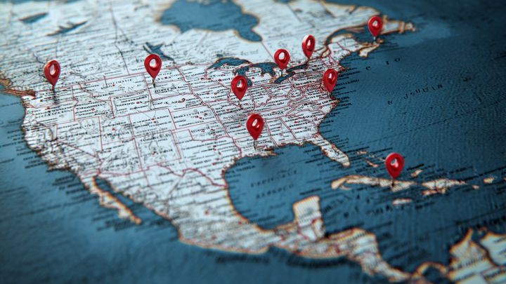 North America map with red Google map markers scattered on the land