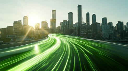 An abstract flow of green light curving toward a downtown city