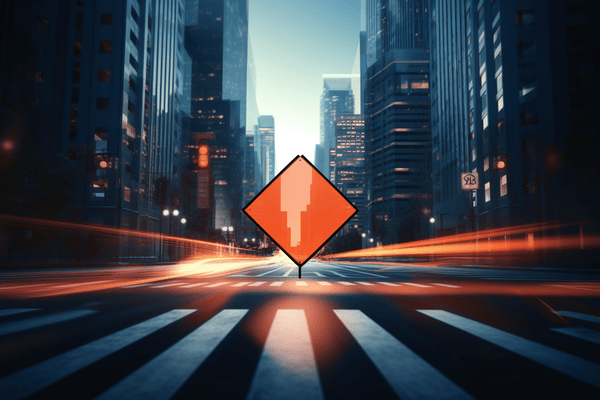 An City Street Flanked by Skyscrapers Heads Toward an Orange Road Sign Illustrating Use Caution
