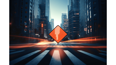 An City Street Flanked by Skyscrapers Heads Toward an Orange Road Sign Illustrating Use Caution