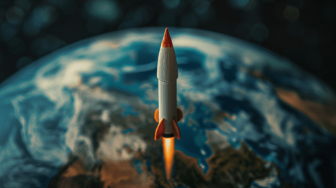 Model toy rocket launching from a globe