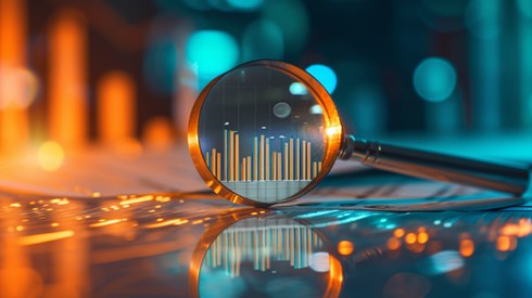 Magnifying glass with an enlarged bar graph able to be seen through it
