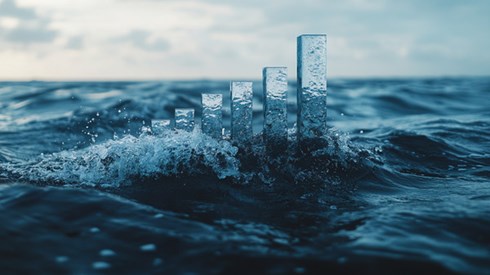 A rising bar graph emerging from the ocean.