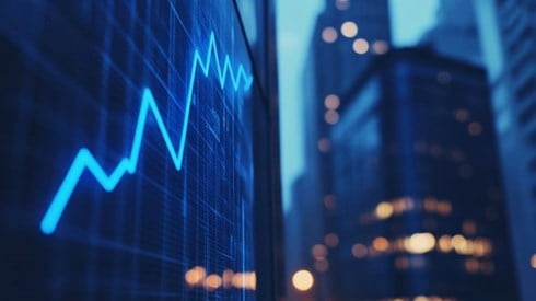 blue line graph going up in front of blurred professional buildings