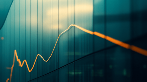 Orange downward trending line graph on the side of a building
