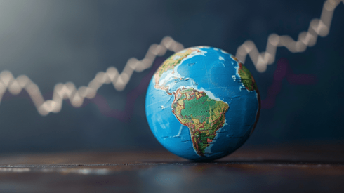 Globe with upward trending line graph in the background