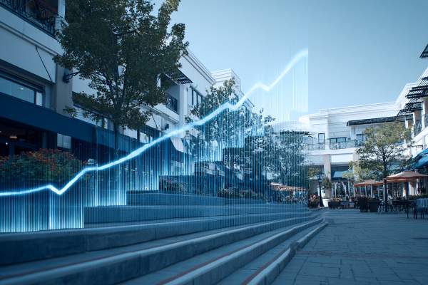 blue line graph going up over a staircase in an outdoor shopping center