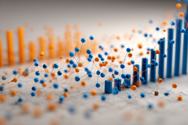 scatter plot of blue and orange dots around a 3D bar chart increasing