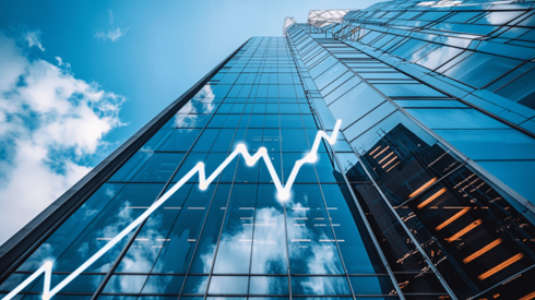 Rising white line graph on the side of a skyscraper