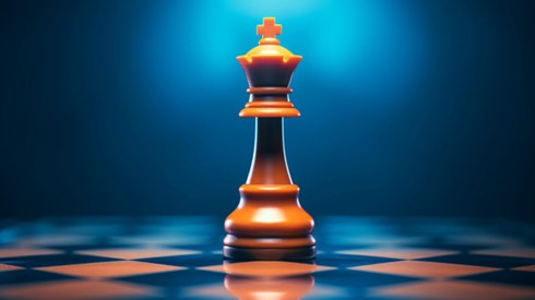 Chess piece sitting in the middle of a chess board