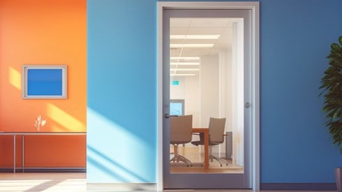 Office with an open door leading to a conference room