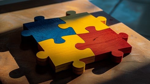 Four brightly colored puzzle pieces fitting neatly together.
