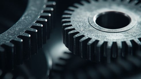 A close-up of two gears.