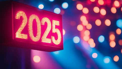 The number "2025" written in lights with out-of-focus bright lights in the background