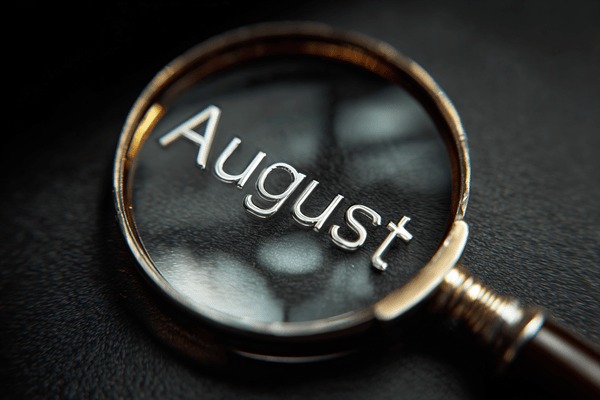 A magnifying glass above the word “August.”