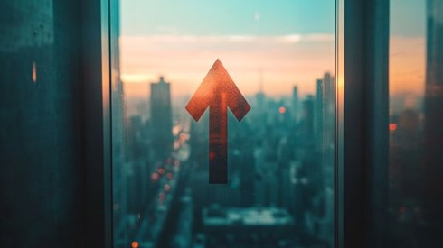 red arrow going up on a window overlooking a city