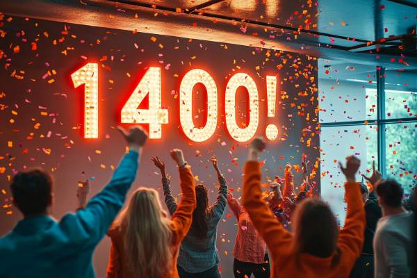 1400! on the wall of an office full of cheering people