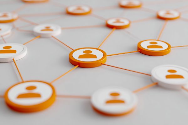 flat discs with people icons connected by orange lines