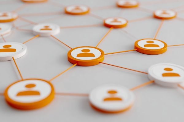 flat discs with people icons connected by orange lines