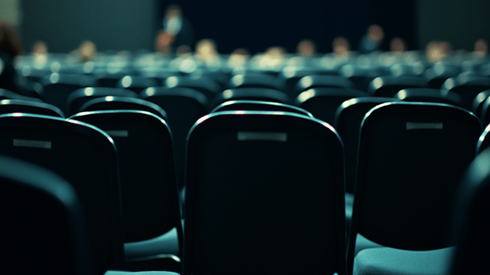 Empty chairs in an audience of a conference